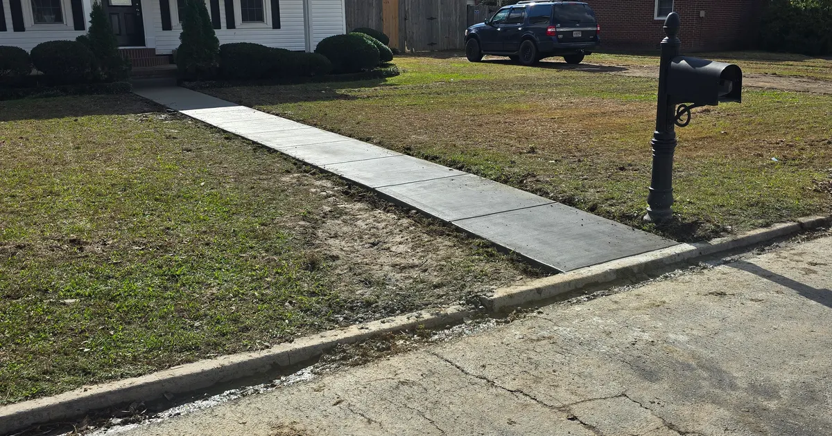 Concrete sidewalk by Advanced Construction Solutions